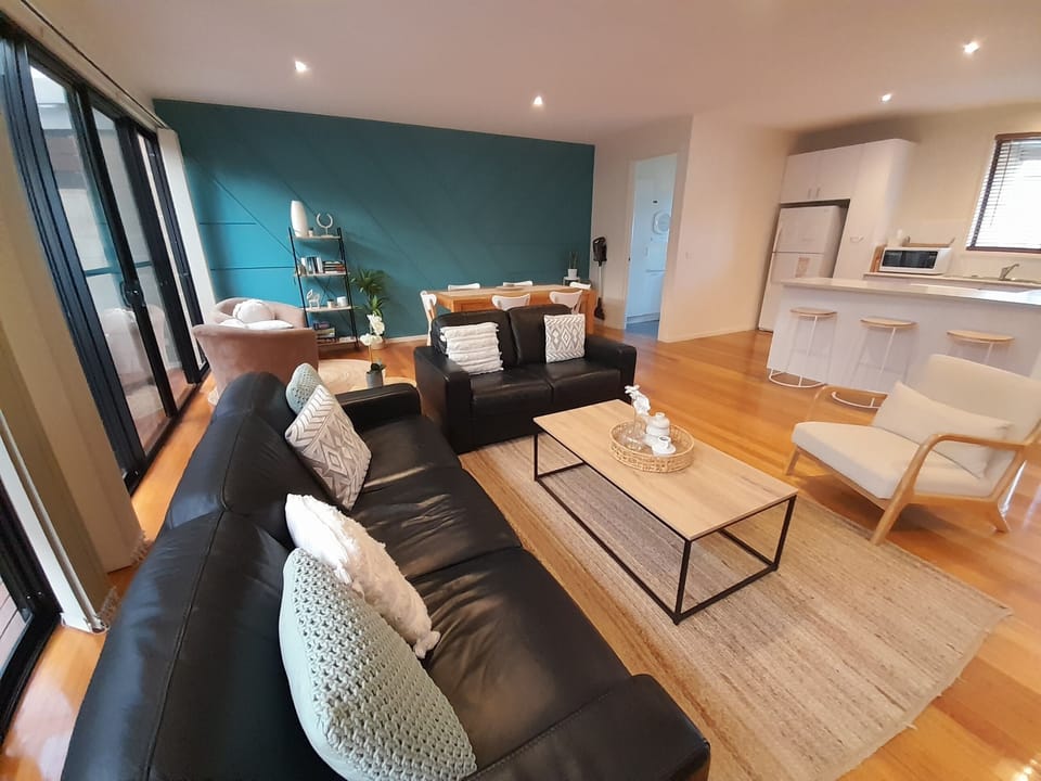 Modern and spacious living area directly off the kitchen. 