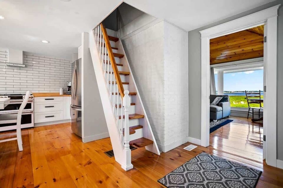 Stairs to sleeping loft. Family room to the right. 