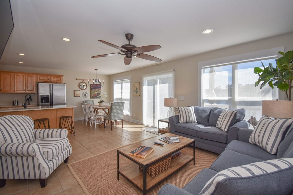 Open kitchen, dining and living areas with more great water views
