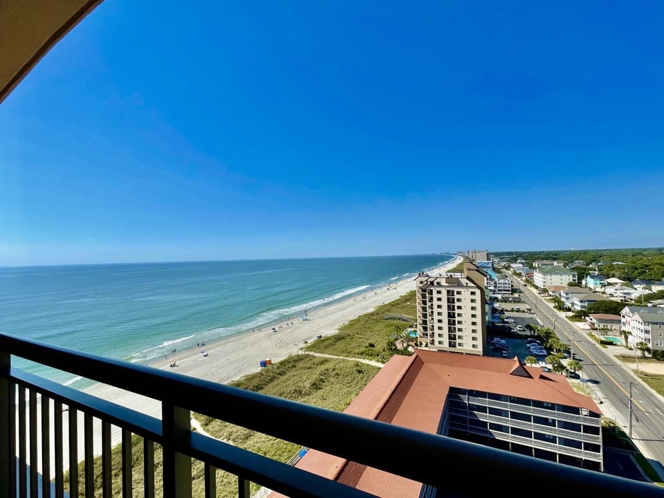 Oceanfront balcony with sweeping coastal views and sea breeze