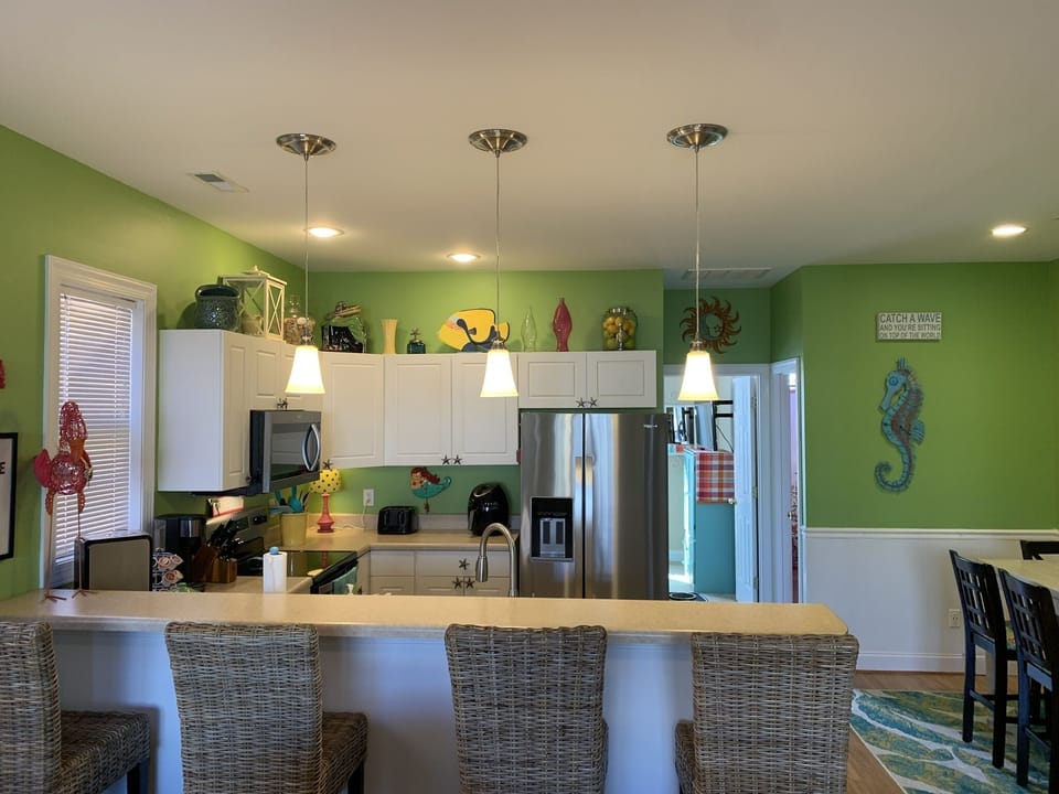 Kitchen area with breakfast bar seating 