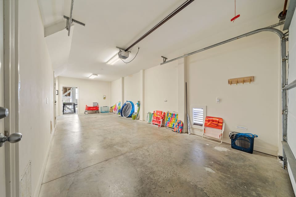 Ample garage with a wagon, beach chairs, body boards and beach tents for use
