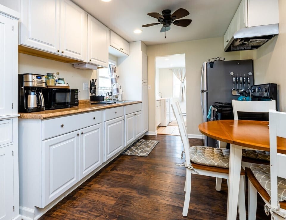Fully equipped kitchen with stainless steel appliances.