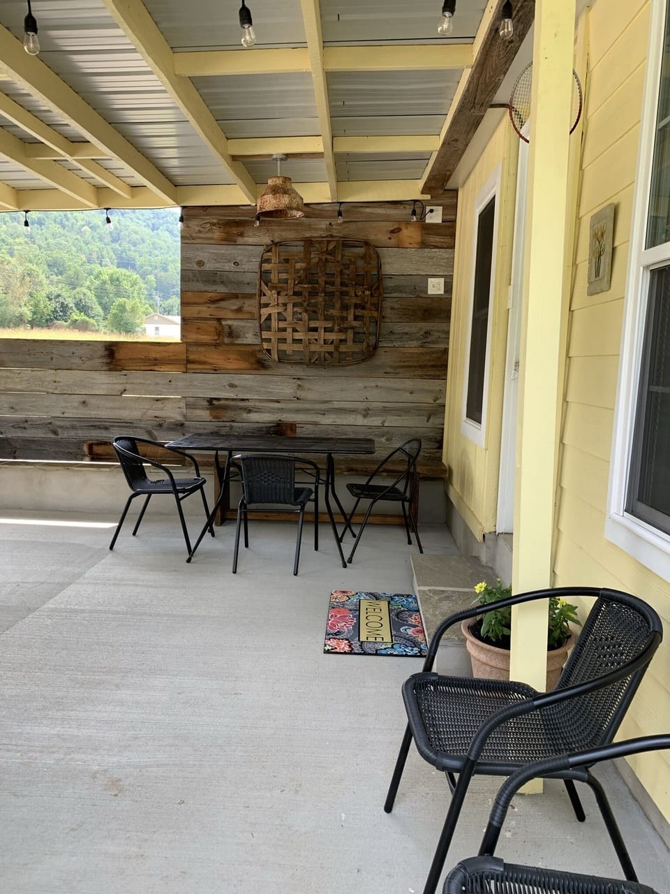 Table and chairs on back patio.