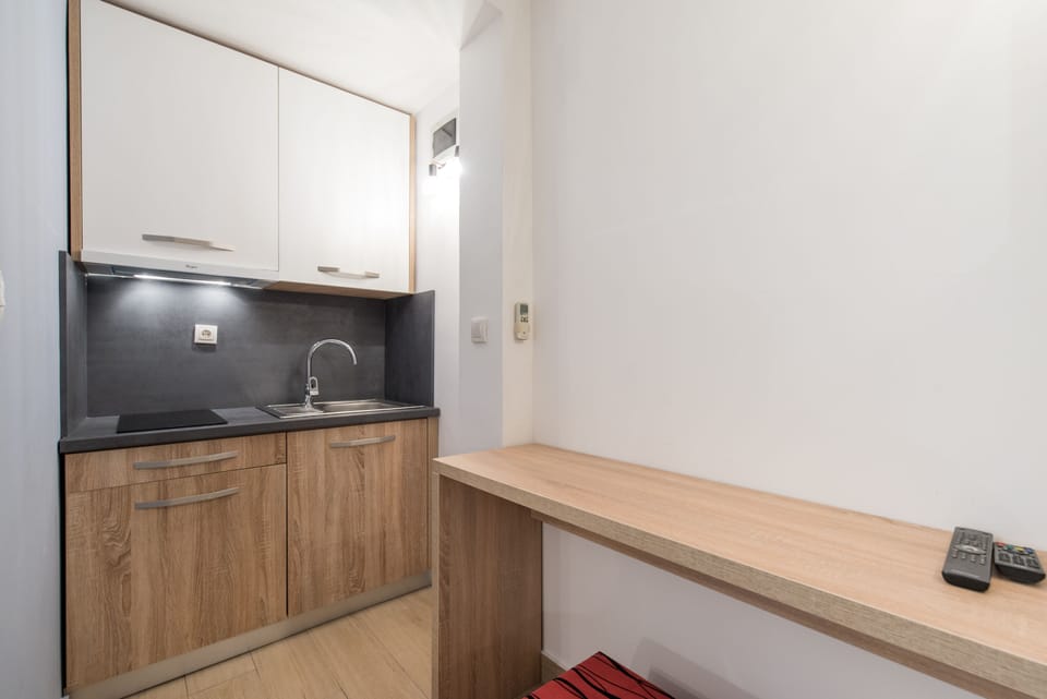 Panoramic Studio, Sea View, Beachfront | Private kitchenette | Fridge, electric kettle, blender, cleaning supplies