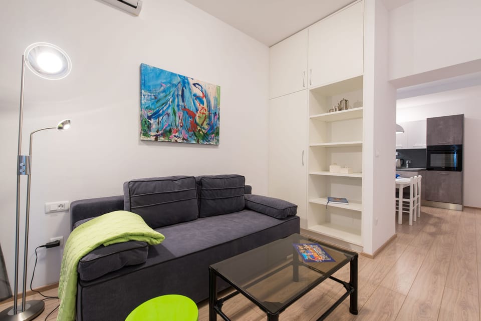 Comfort Apartment, 1 Bedroom, Balcony, Courtyard View | Living room | 100-cm flat-screen TV with satellite channels, TV
