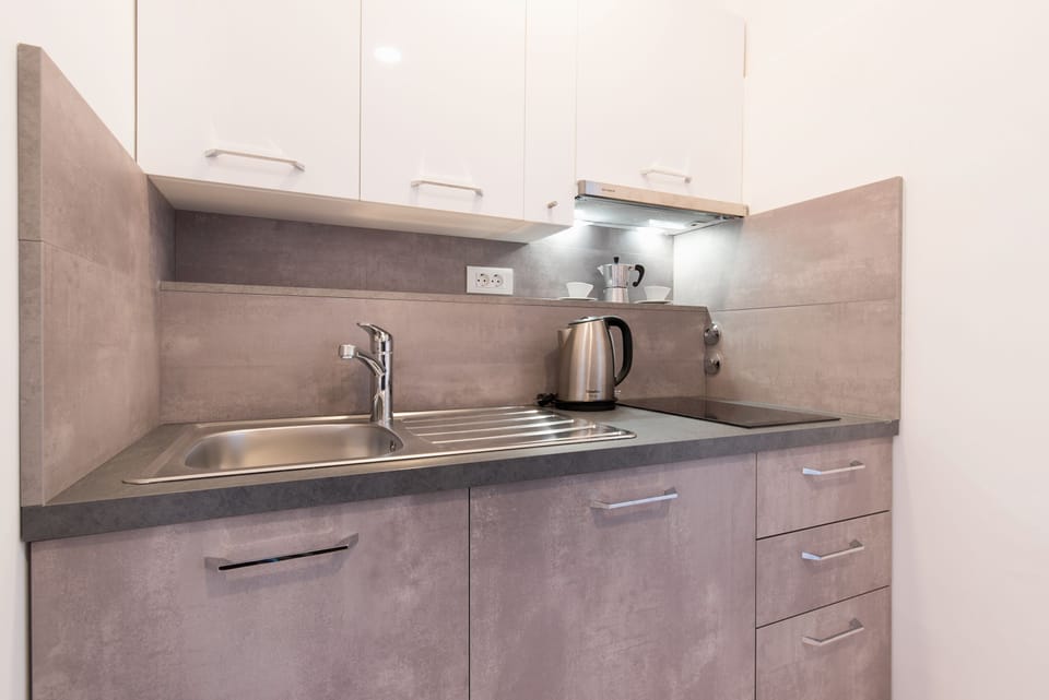 Superior Studio Suite, Sea View | Private kitchenette | Fridge, electric kettle, blender, cleaning supplies