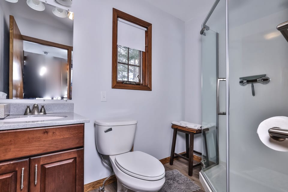 Cute modern bathroom equipped with a stand up shower