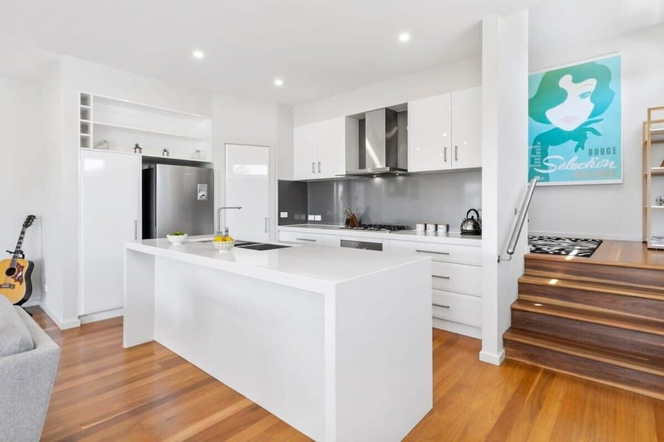 Open plan living, kitchen and dining area make the most of the lake views