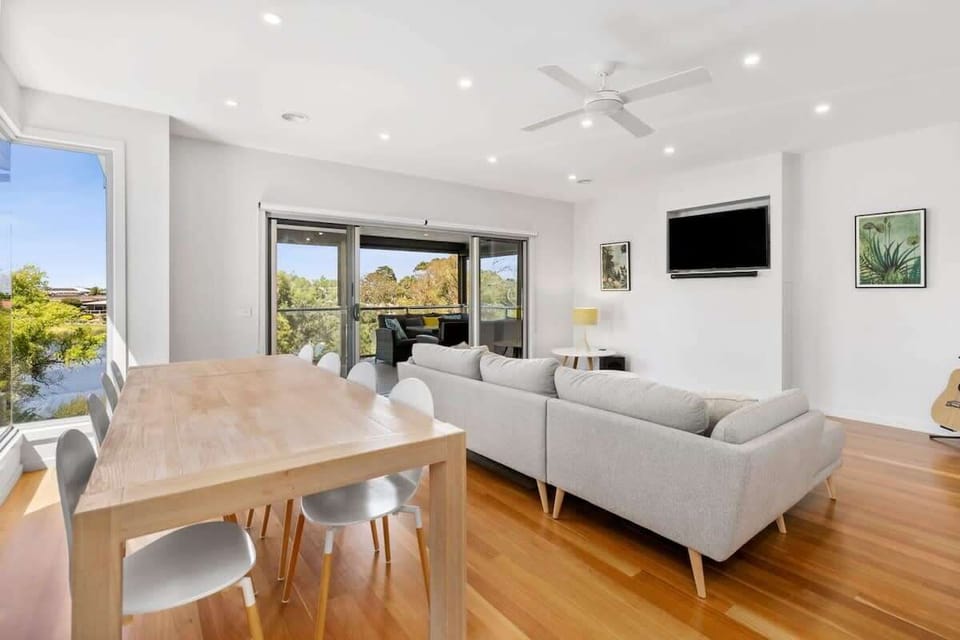Open plan living, kitchen and dining area make the most of the lake views