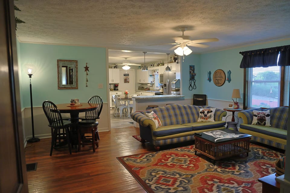 Couch, love seat, table with 4 stools and bar with 2 stools