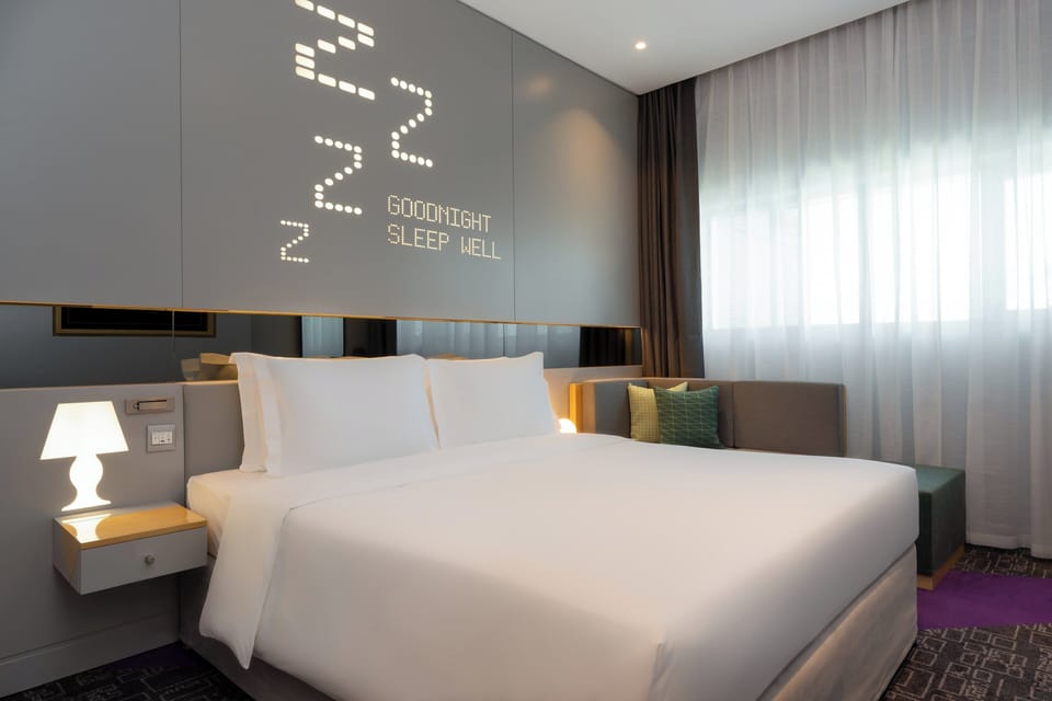 Room, 1 King Bed (Urban King) | Minibar, in-room safe, desk, laptop workspace