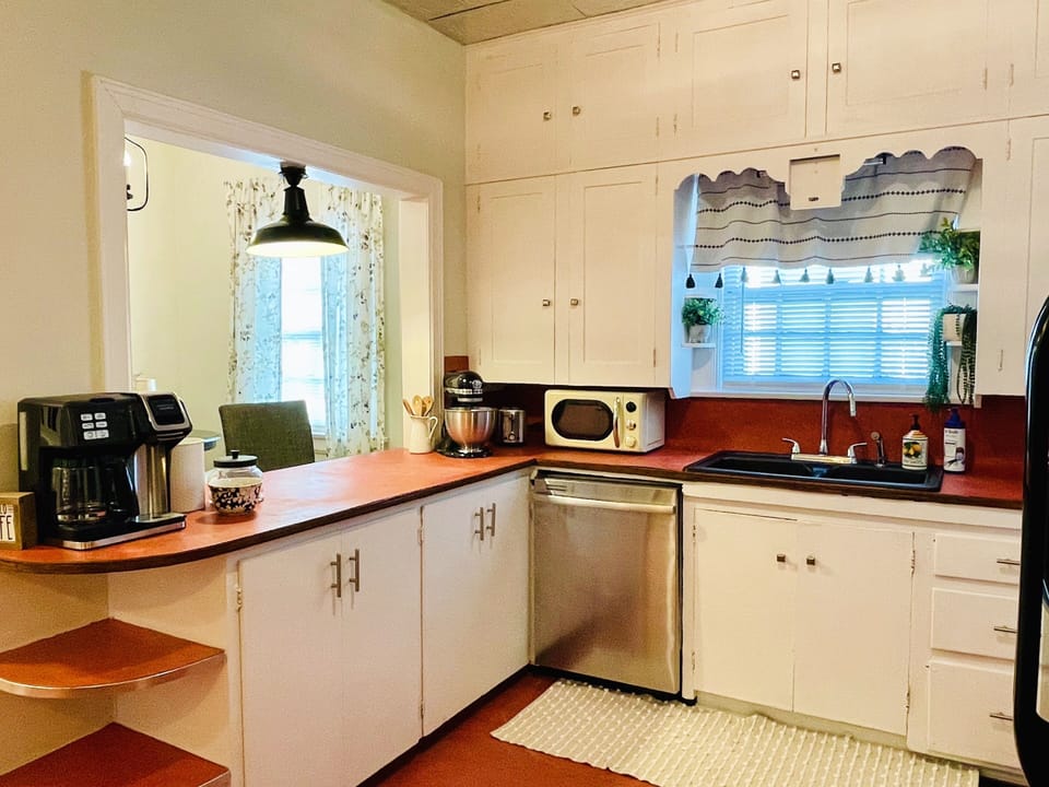 Fully stocked LARGE kitchen with attached breakfast nook and eat in bar.