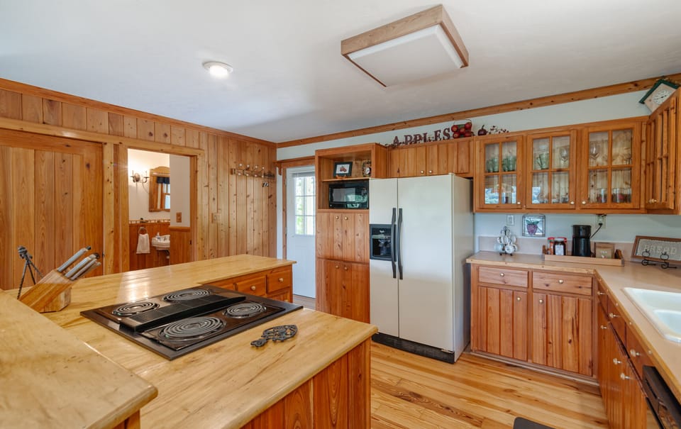 Entry way to home and fully stocked kitchen.