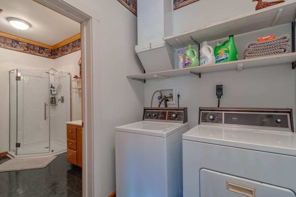 Washer/dryer and bottom floor bathroom.
