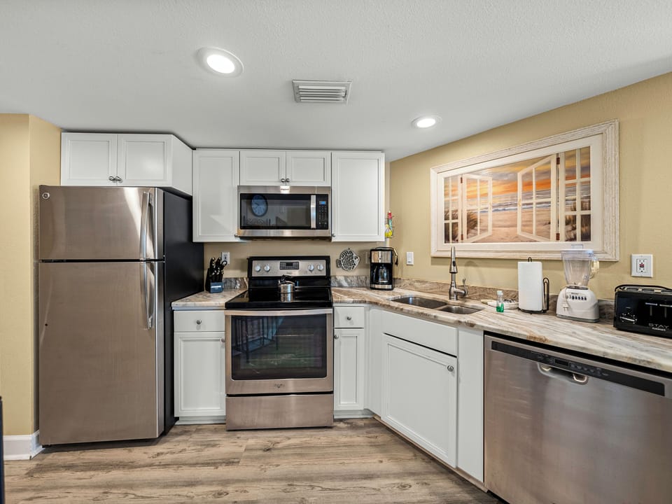 Updated Kitchen with appliances. Fully stocked for a great eat in experience