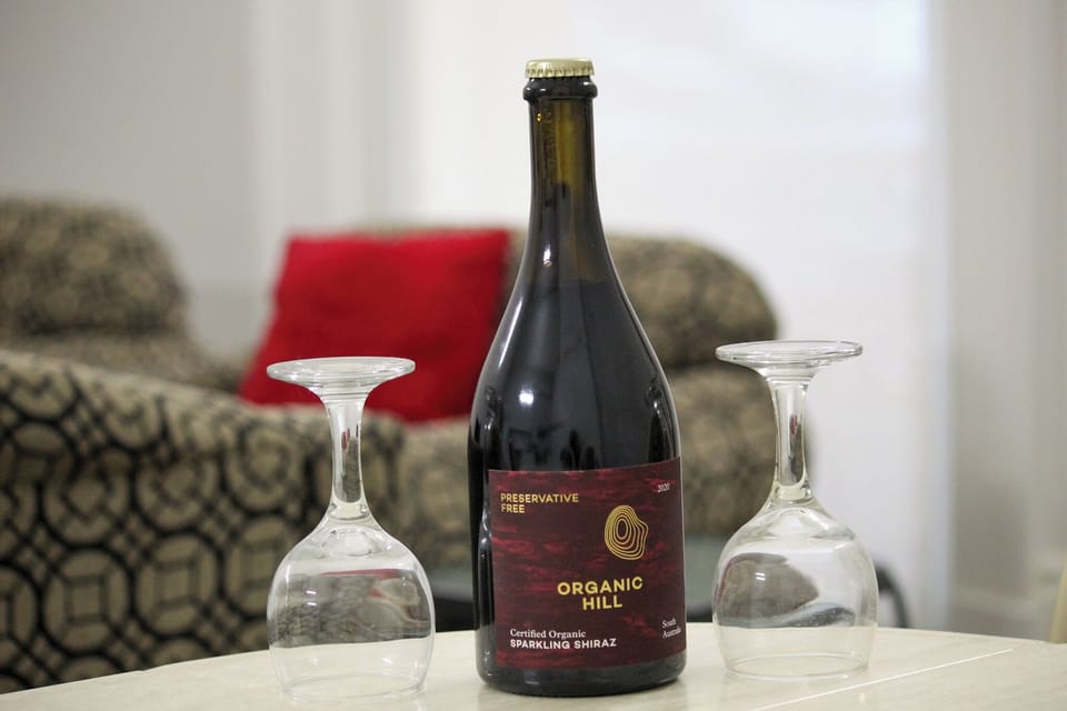 A full-sized dining table provides the perfect setting for shared meals, celebrations, or planning the next day’s adventures. (Wine pictured is for styling purposes only.)
