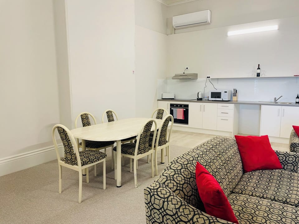 Features open-plan living and dining, a well-equipped kitchen, smart TV, split-system air conditioning, and a sleek, modern bathroom—designed for comfort and convenience.