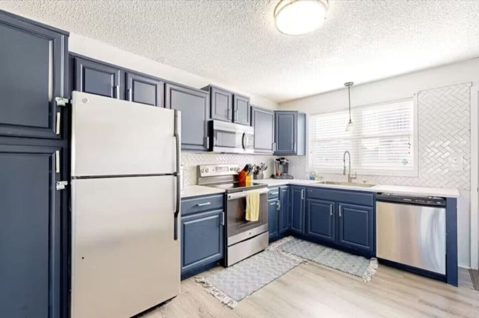 Kitchen- Refrigerator, Stove, and dishwasher