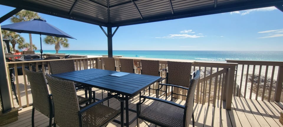 Deck Oasis: Enjoy your meals or coffee while enjoying the beach