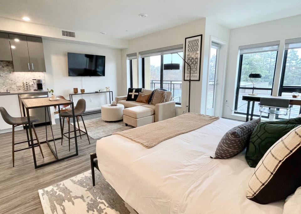 King Bed outfitted with luxury bedding atop a supportive hybrid mattress 