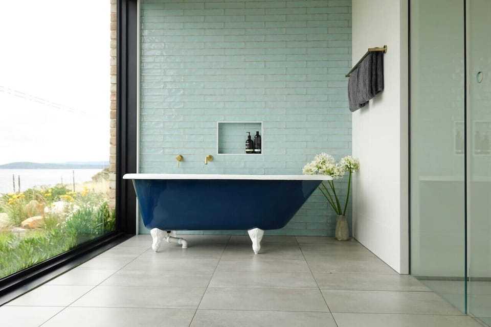 Soaking Bath Tub with large walk-in Rain shower as showcased in Tub`d