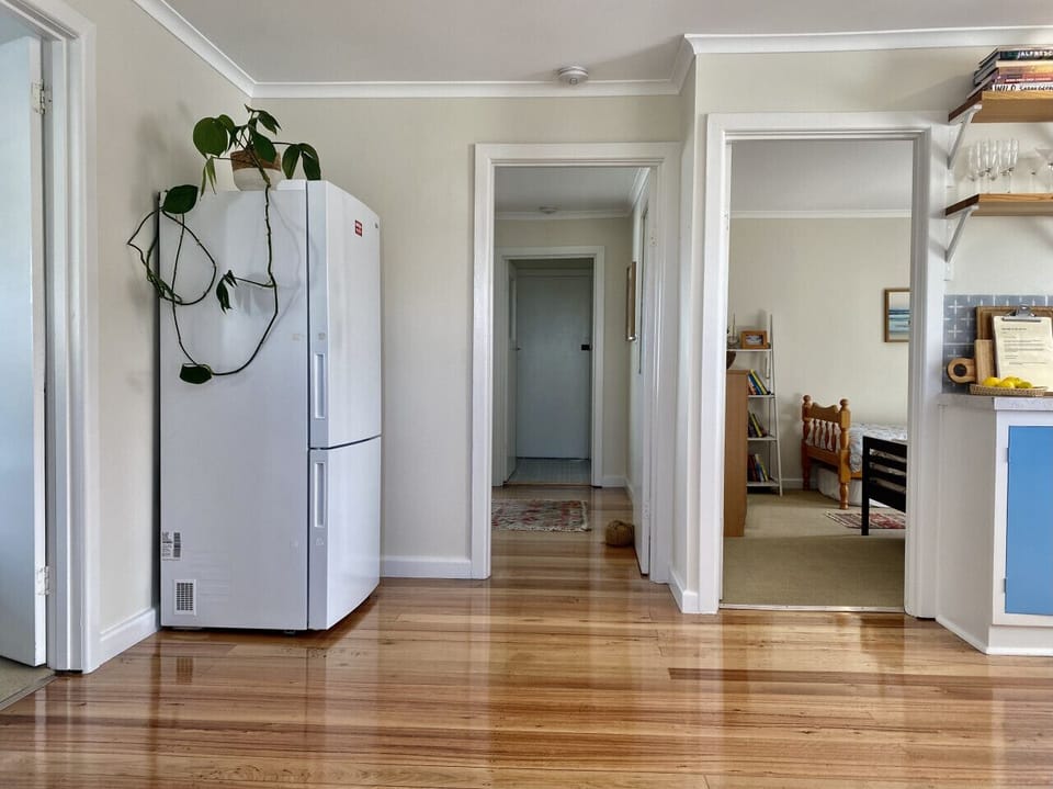 The 2 bedrooms are adjacent the kitchen, leaving room at the back to take in the view from the living and bathroom.