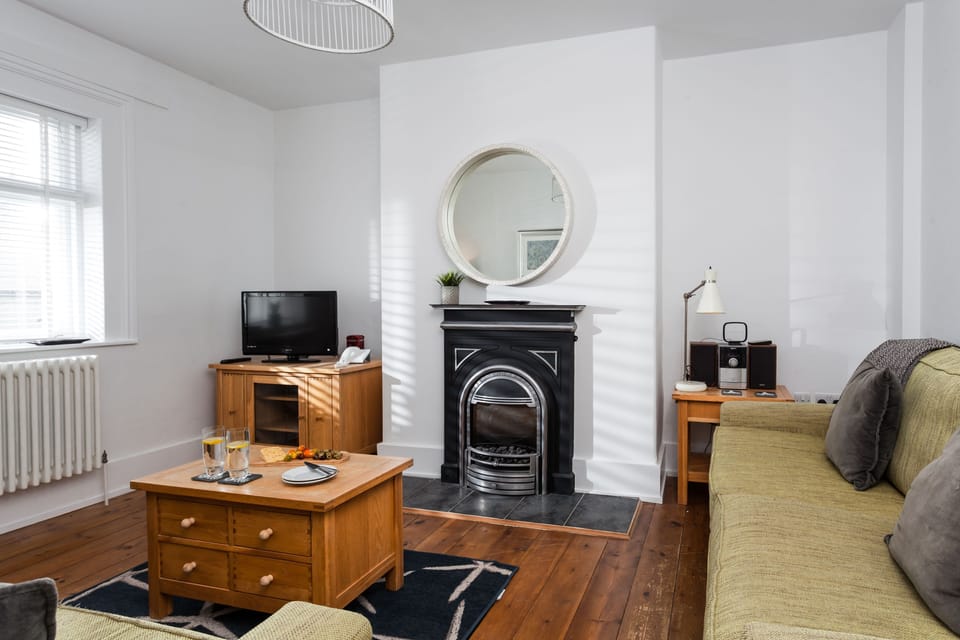 Sitting room with electric living flame effect fire (please note, there is now a new sofa)