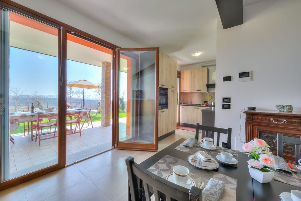 Living room with dining table and equipped kitchen