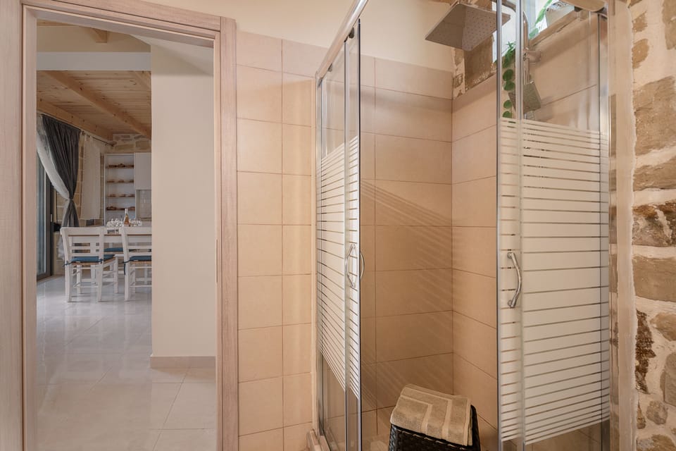 Shower, rainfall showerhead, hair dryer, towels