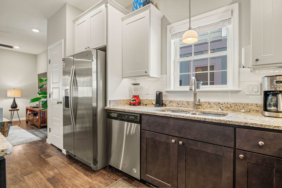 Kitchen with Bar Stool Seating on First Level