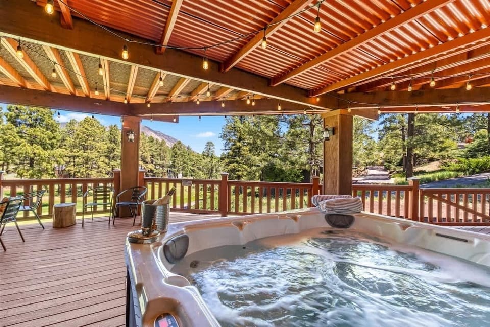 End Your Day with a Hot Tub Soak Under the Covered Deck