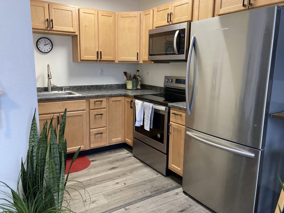 Well stocked kitchen with full size fridge, freezer, oven, range, microwave, etc
