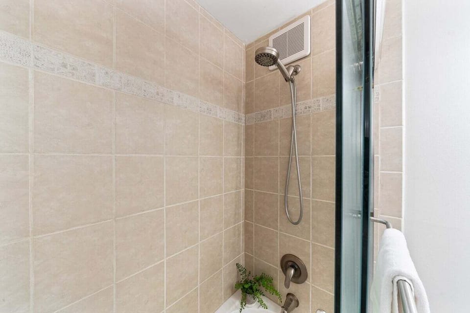 Tub and shower combo, perfect for rinsing after a day in the beach