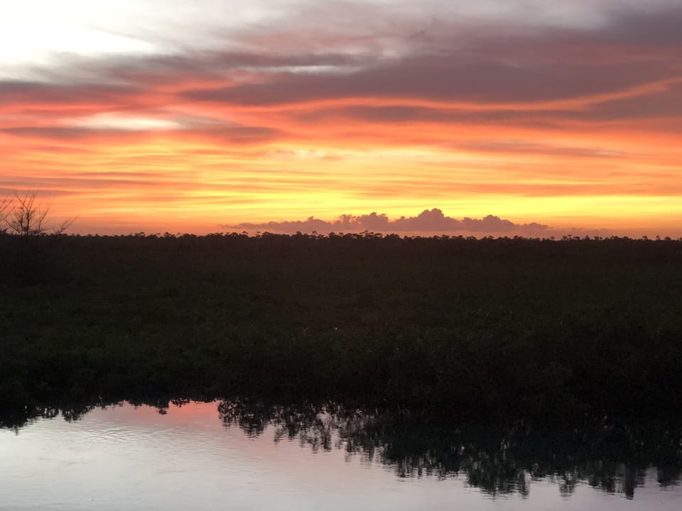 Sunset taken from rear deck while grilling fresh caught snapper.