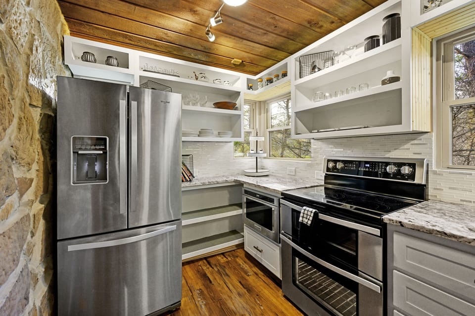 Stainless steel fridge, microwave, double oven.  Plenty of shelves and dishware!