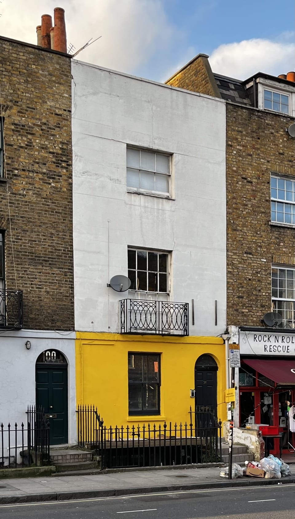 The yellow ground floor of number 98 Parkway is unmistakable 