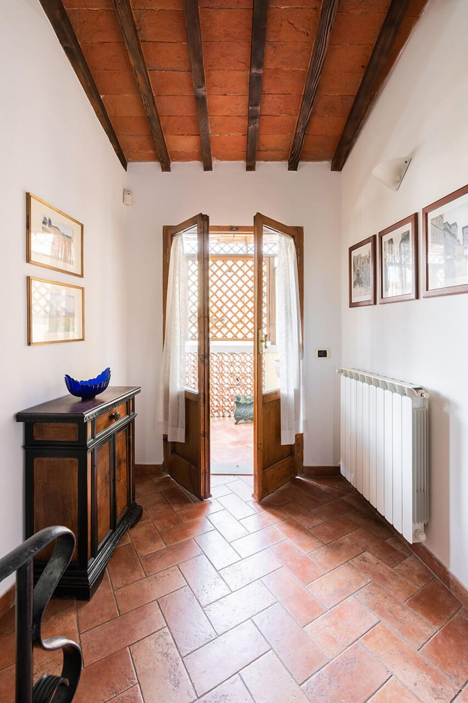 Terrace is accessed off the upper lever, next to bedroom.