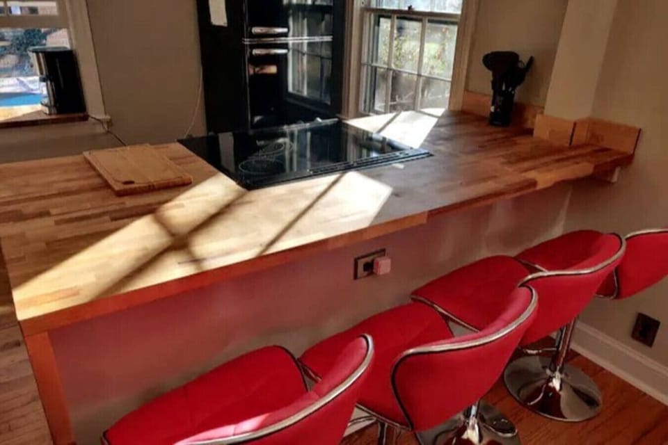 Scoot right up! These bright red retro barstools with memory foam allow you to sit at the bar and eat your meal hot off the stove!