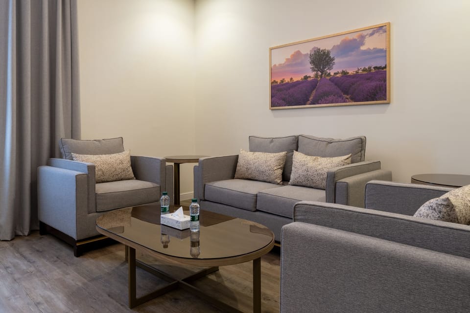 Executive Suite, 1 King Bed | Living area | LED TV, fireplace