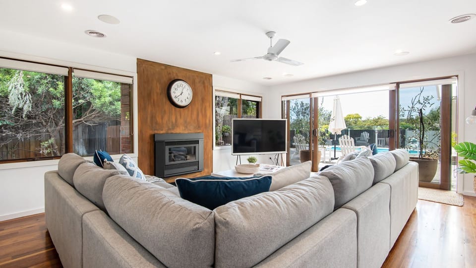Second living area looking out to the pool. Gas fireplace 