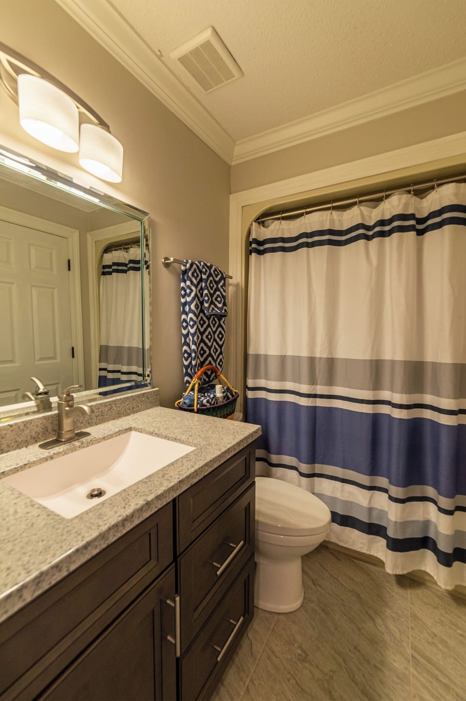 Your Tropical Retreat second bathroom has shower/tub combo and opens to the second bedroom and the hallway.
