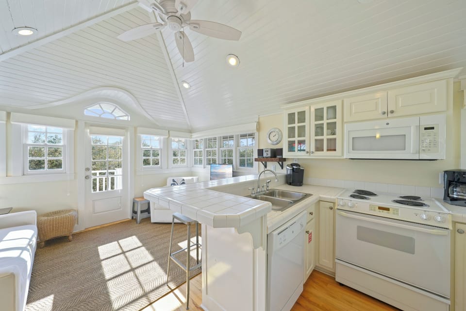 FULLY EQUIPPED KITCHEN ON SECOND STORY FACING BALCONY