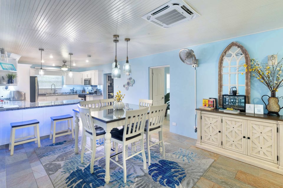 A dining table and breakfast bar to enjoy sit-down meals