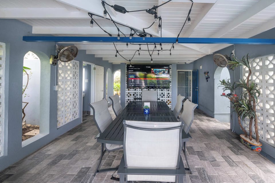 Outdoor dining space with comfortable seating and a large table