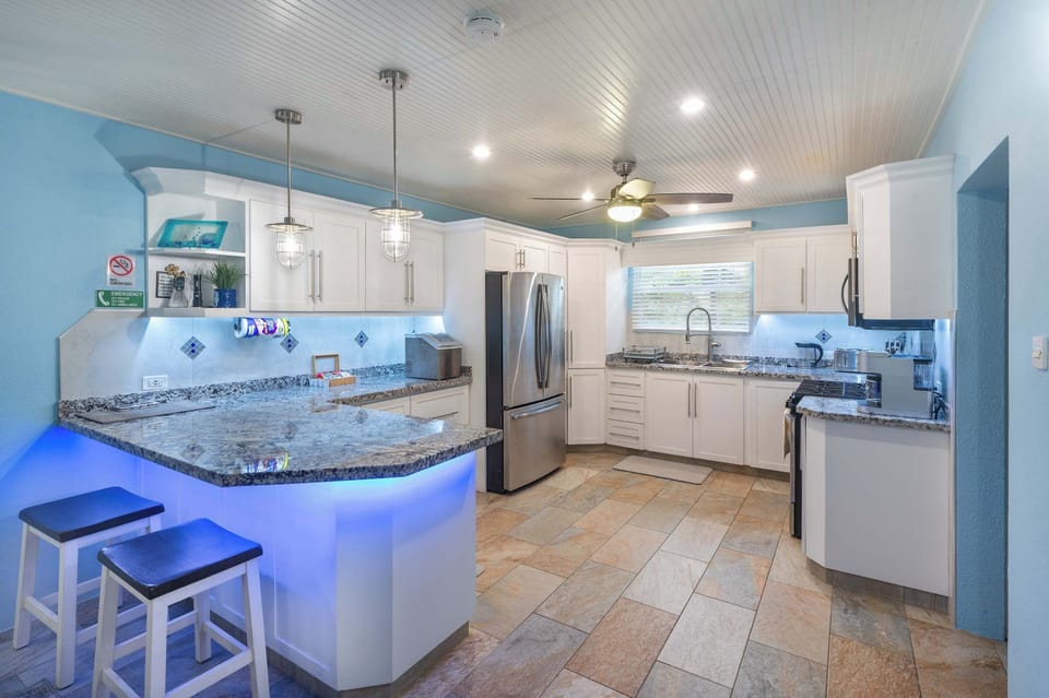 The kitchen w/ stainless steel appliances & all you need to prepare meals at home.
