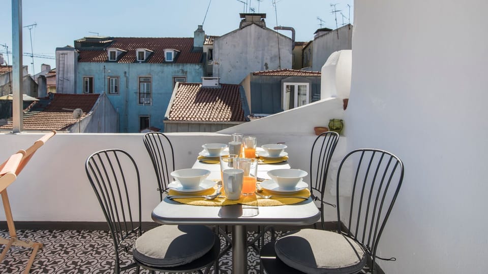 Imagine yourself here relaxing with good conversation and a glass of wine... #airbnb #airbnblisbon #portugal #pt #lisbon #terrace #view #city
