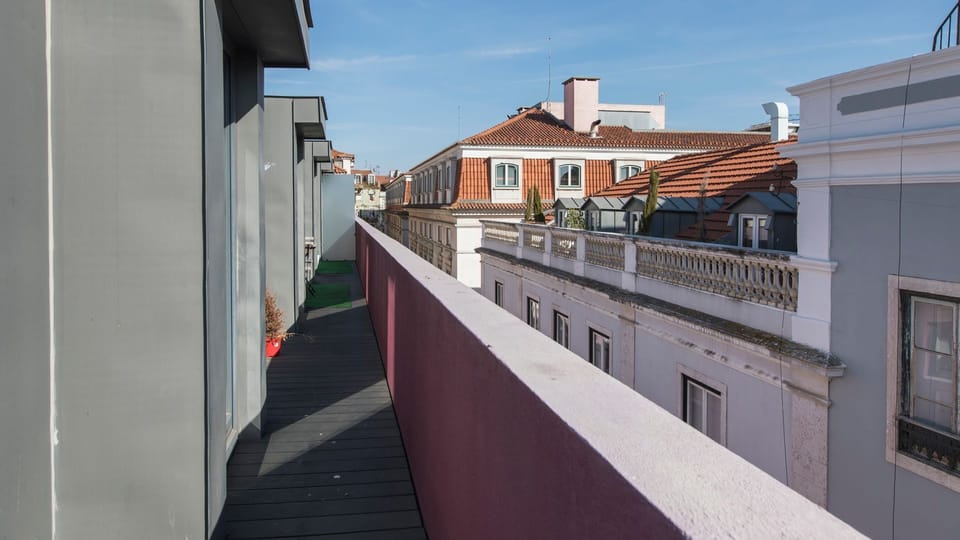 Step out onto your private balcony and breathe in the fresh air while admiring the charming rooftop views of the city, perfect for a peaceful morning coffee or an evening aperitif. This narrow outdoor space offers a unique perspective on the urban landsca