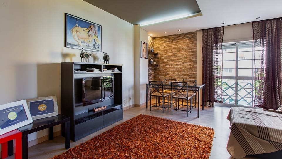 Unwind in this bright living space, perfect for movie nights or enjoying meals at the inviting dining area.
#LivingRoom #CityView #LovelyStay