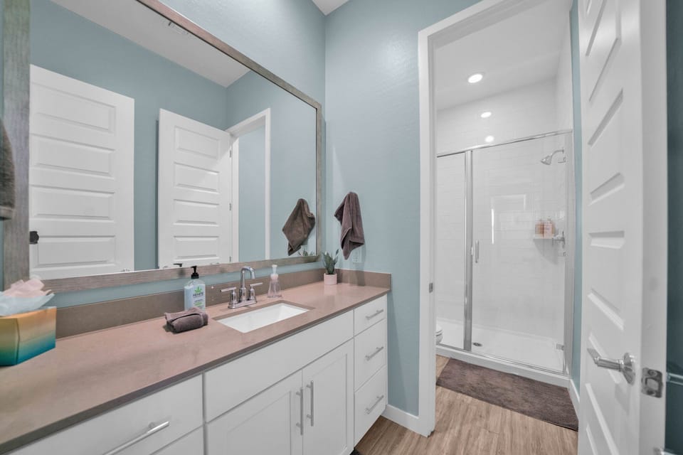 Bathroom #2 w/ custom tile shower. Separate doors allow for give extra privacy.